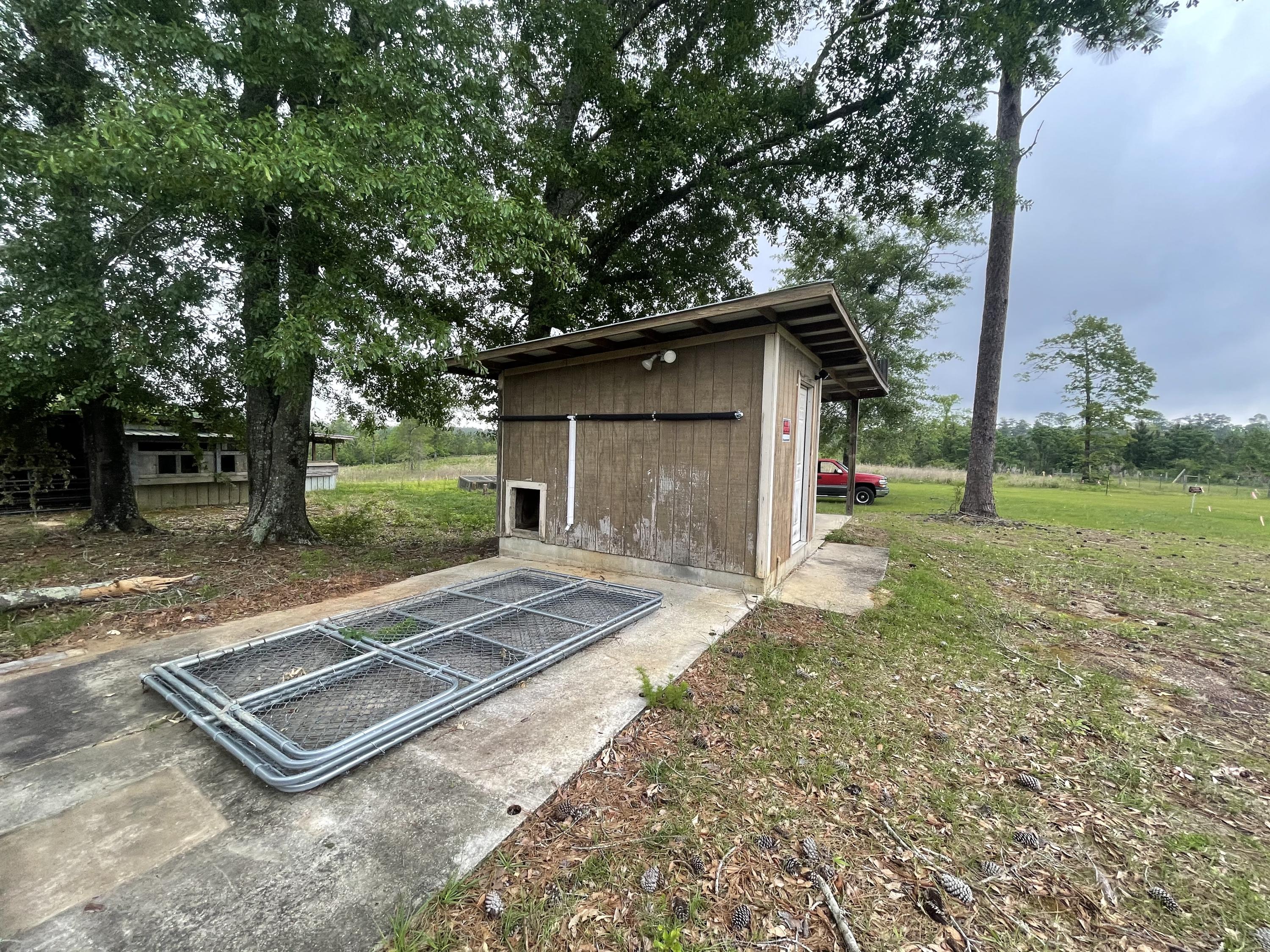 12.49-ac State Line Road Baker, FL 32531 - Photo 13 of 41 a front view of a house with a yard