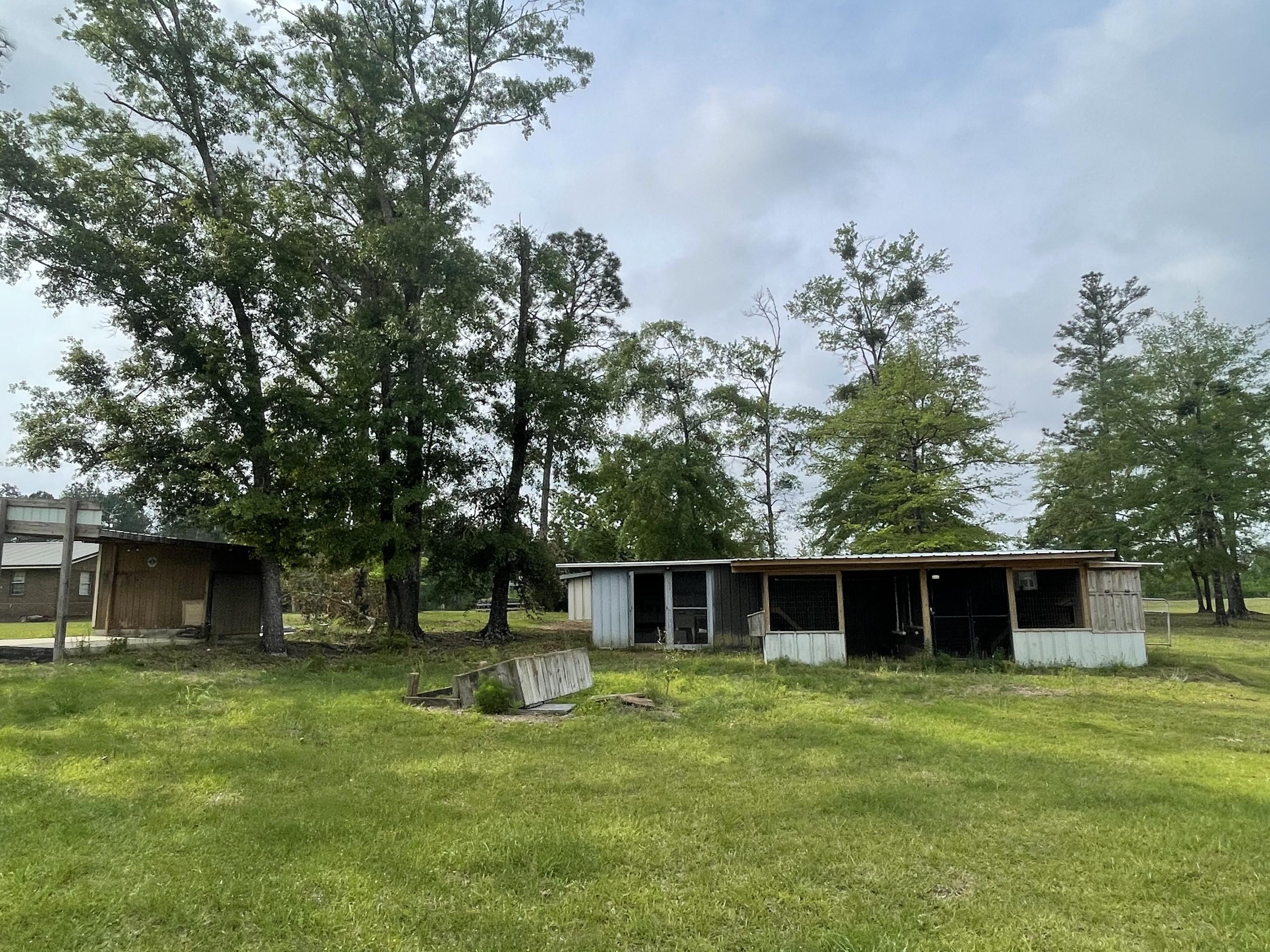 12.49-ac State Line Road Baker, FL 32531 - Photo 4 of 41 a front view of a house with a yard