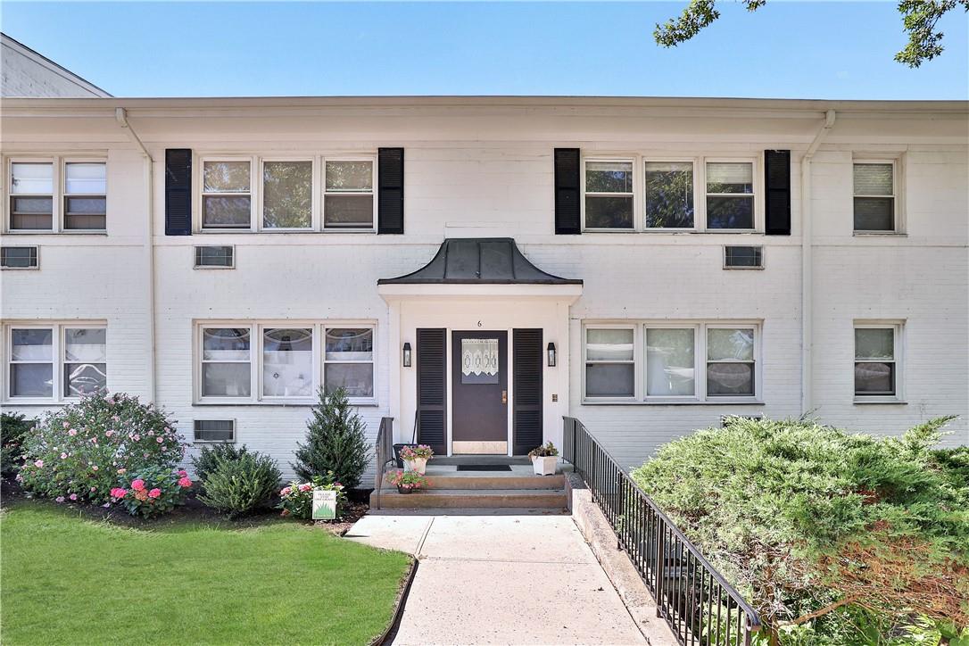 6 Avon Circle, Unit D Rye Brook, NY 10573 - Photo 1 of 1 a front view of house with yard and green space