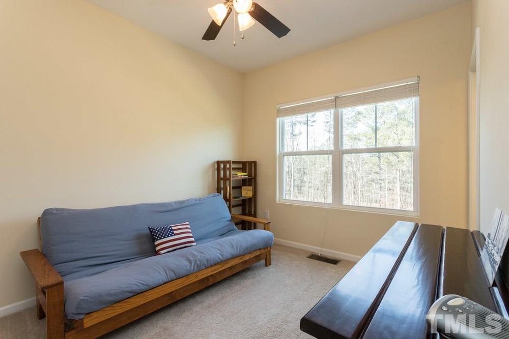 1619 Crafton Way Raleigh, NC 27607 - Photo 17 of 25 a living room with furniture and a window