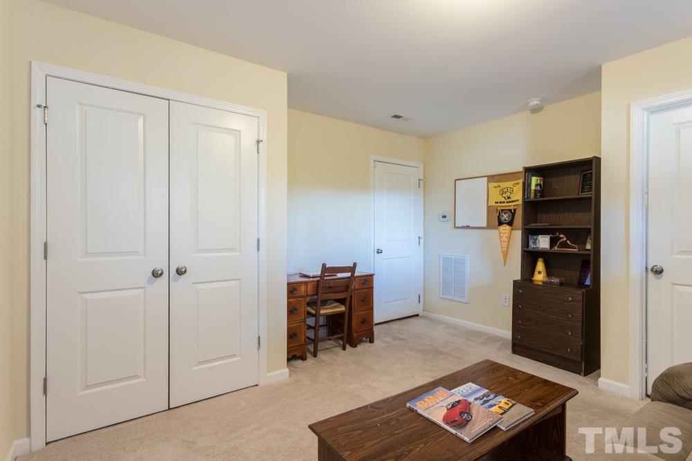 1619 Crafton Way Raleigh, NC 27607 - Photo 25 of 25 a living room with furniture and a table
