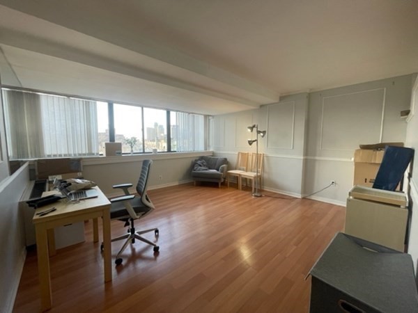 a workspace with furniture and window