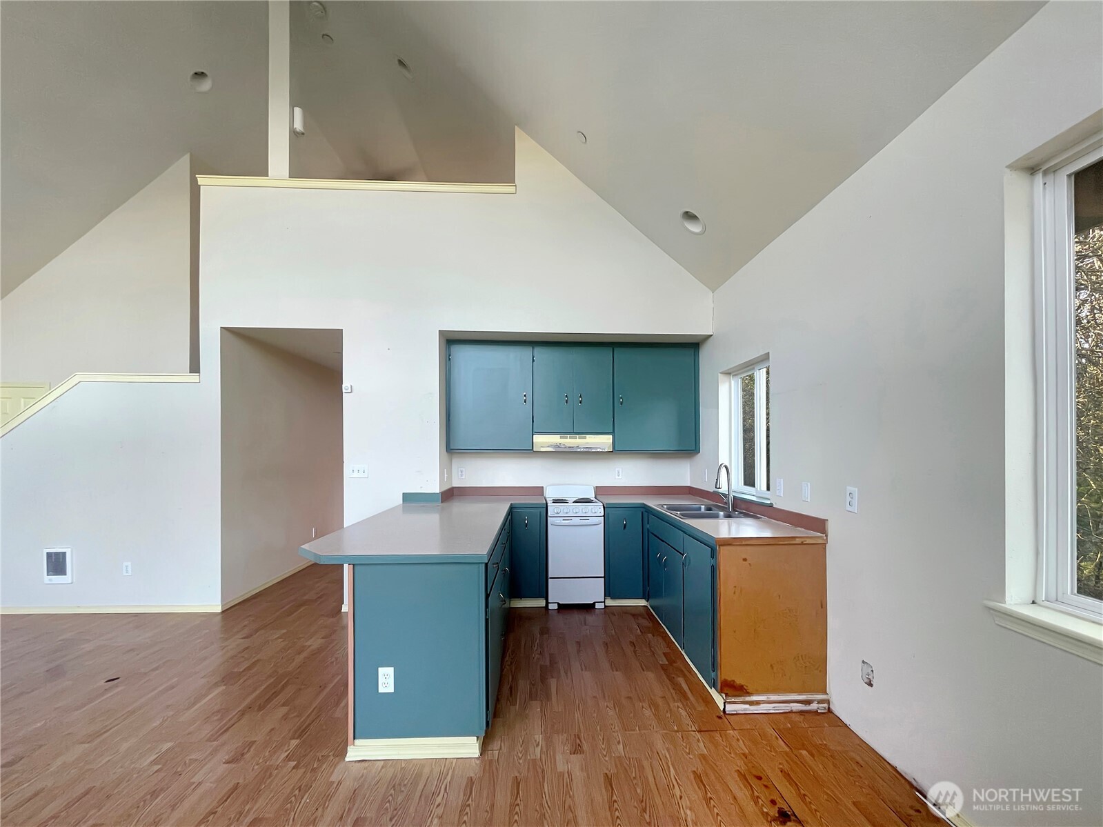 11 North Hamma Ridge Drive Lilliwaup, WA 98555 - Photo 14 of 40 a kitchen with stainless steel appliances granite countertop a sink stove and refrigerator
