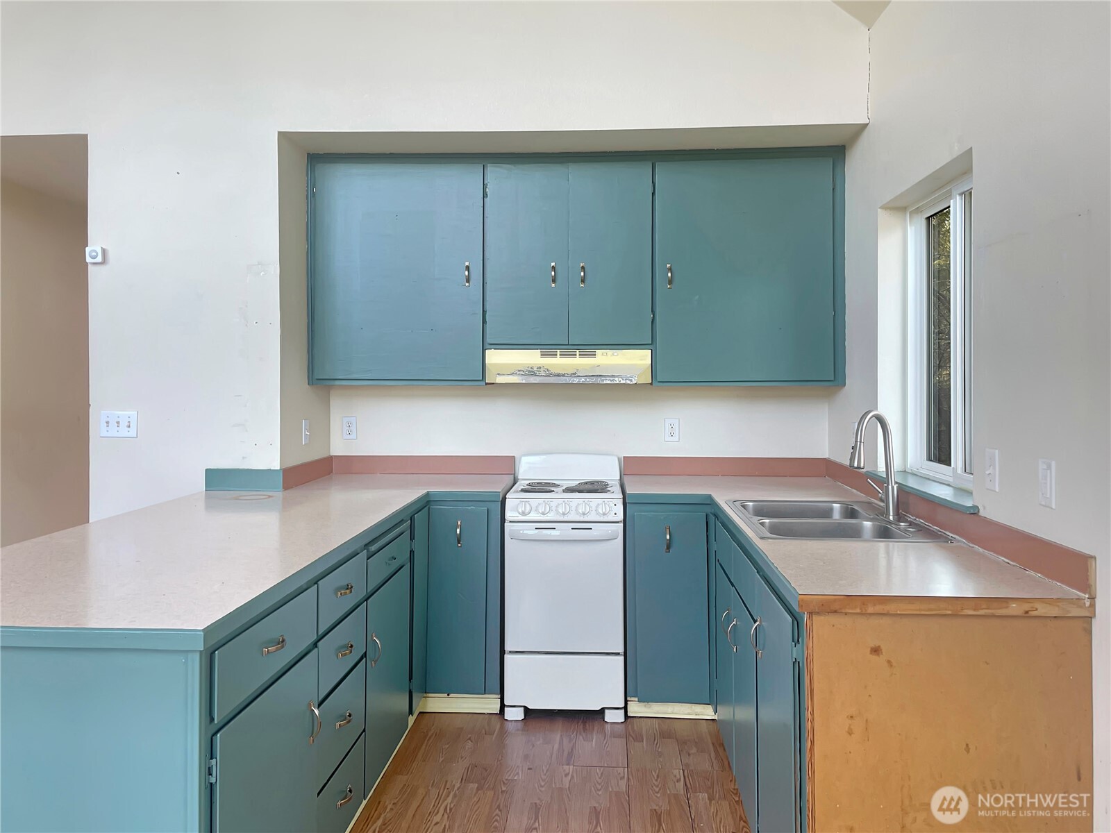 11 North Hamma Ridge Drive Lilliwaup, WA 98555 - Photo 16 of 40 a kitchen with a sink cabinets and wooden floor