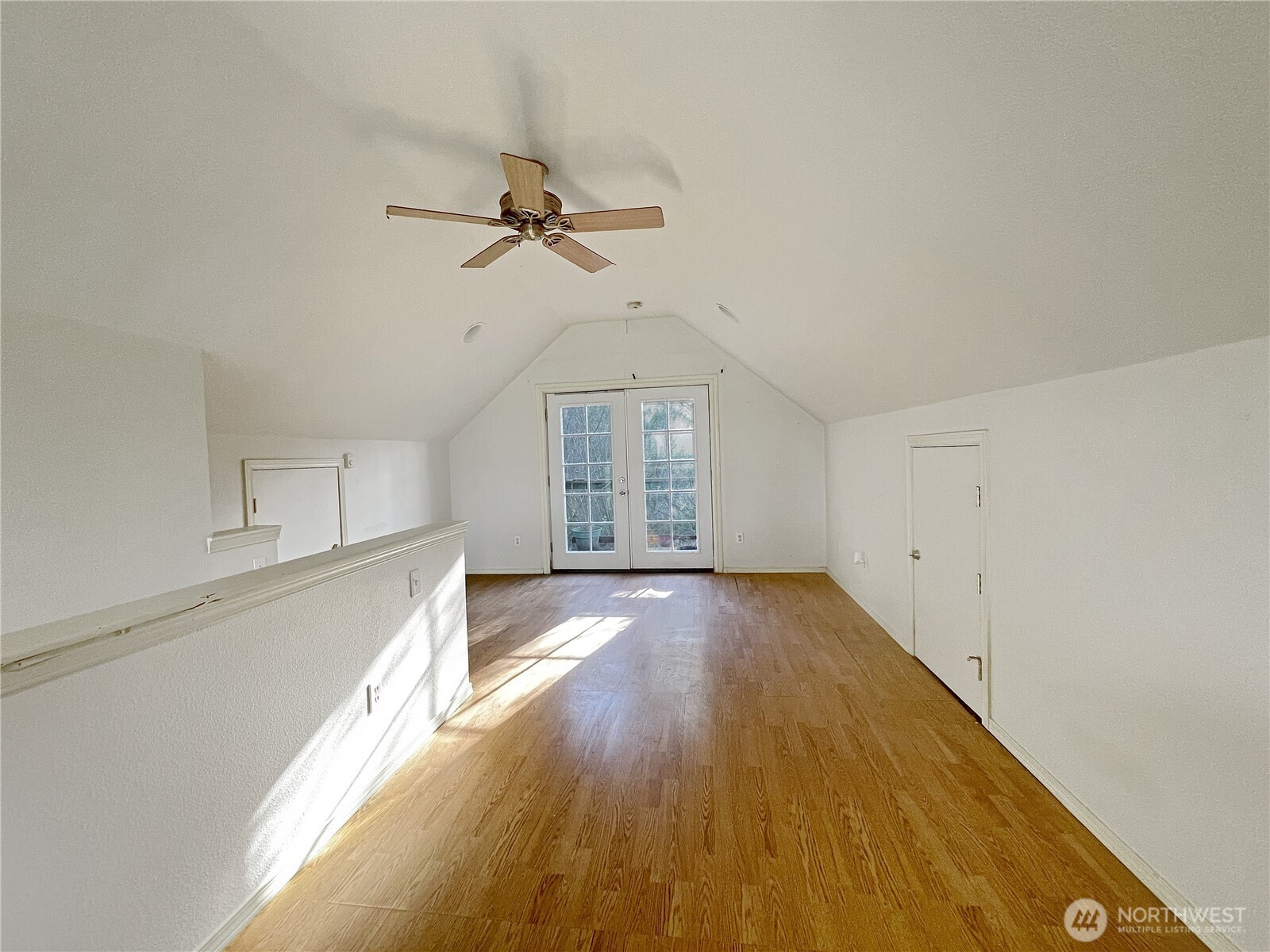 11 North Hamma Ridge Drive Lilliwaup, WA 98555 - Photo 25 of 40 a view of empty room with wooden floor and fan