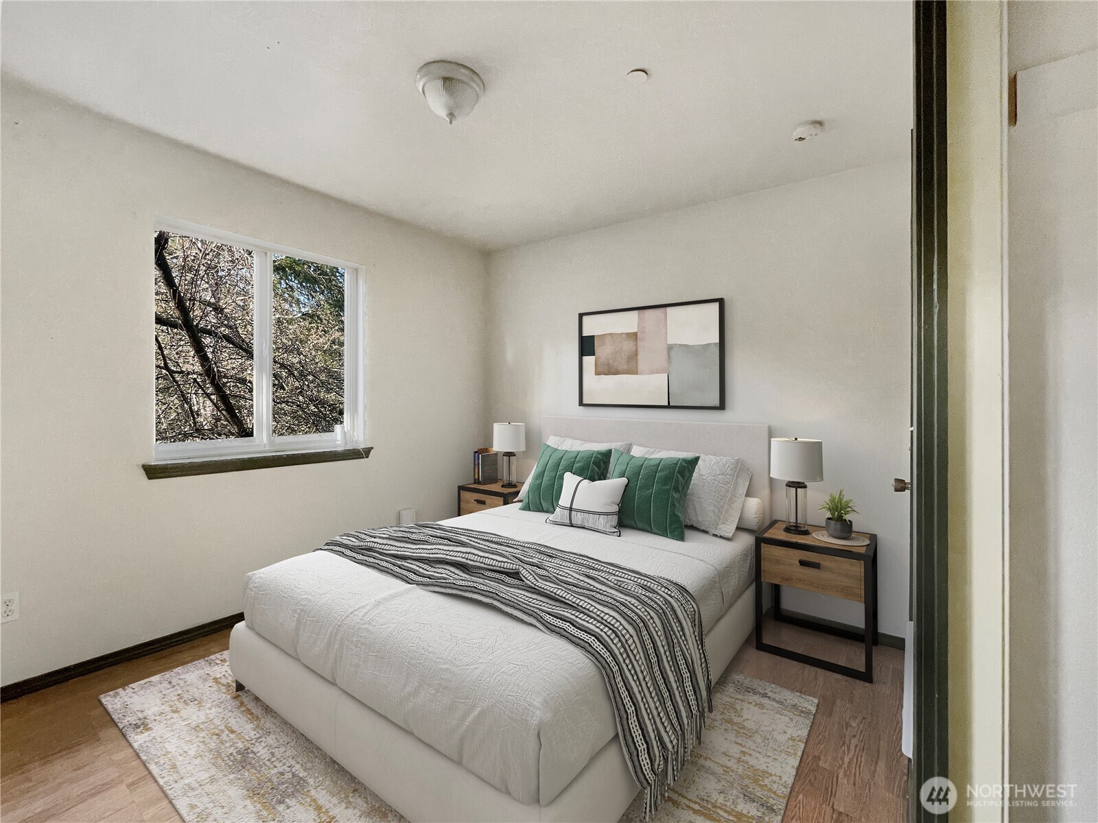 11 North Hamma Ridge Drive Lilliwaup, WA 98555 - Photo 31 of 40 a bedroom with a bed and a painting on the wall