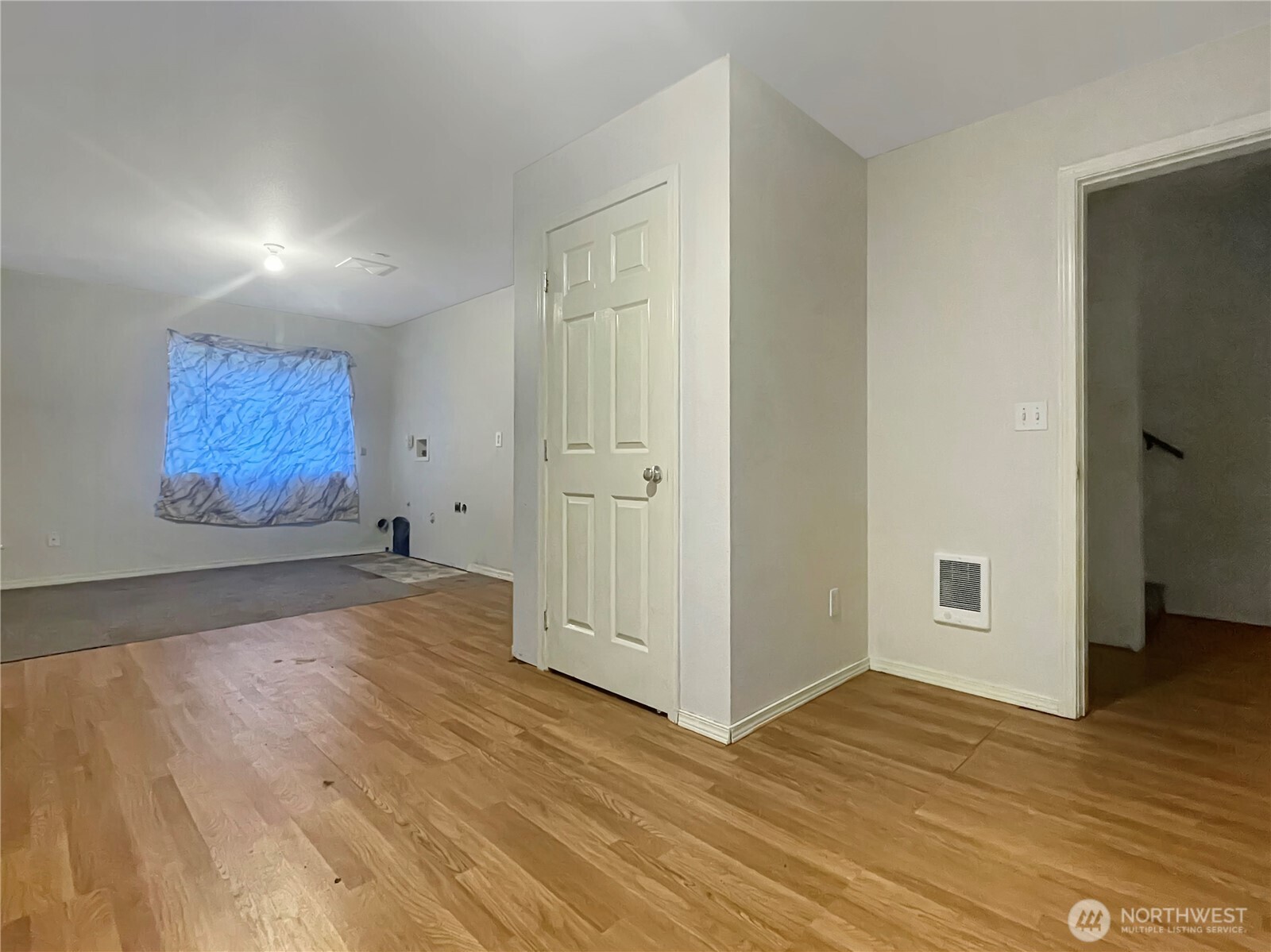 11 North Hamma Ridge Drive Lilliwaup, WA 98555 - Photo 32 of 40 an empty room with wooden floor and windows