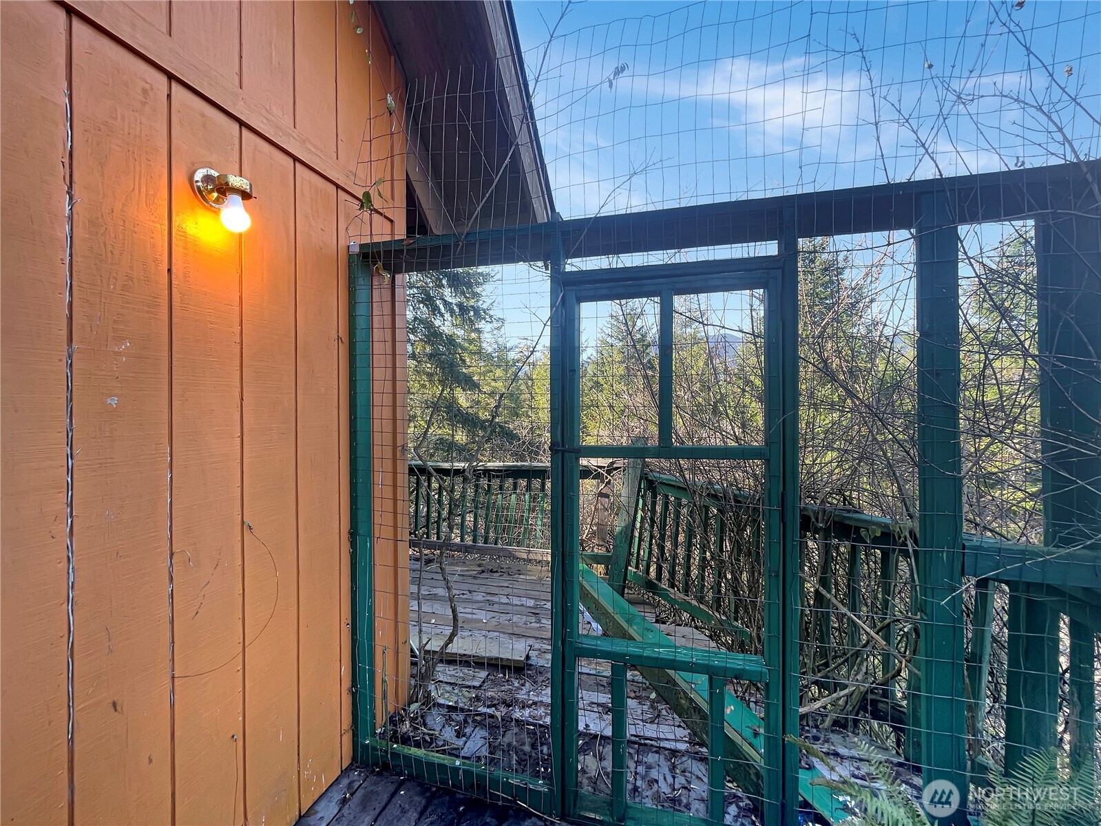 11 North Hamma Ridge Drive Lilliwaup, WA 98555 - Photo 7 of 40 a view of a porch with a table and chairs