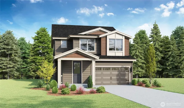 a front view of a house with a yard and garage