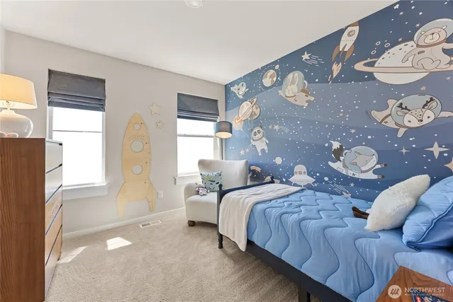 a bedroom with bed and a window