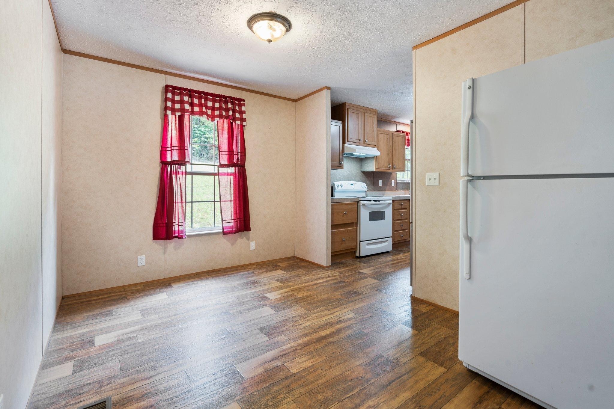 171 Buckner Road Philadelphia, TN 37846 - Photo 15 of 27 a view of kitchen with stainless steel appliances granite countertop a refrigerator and a stove