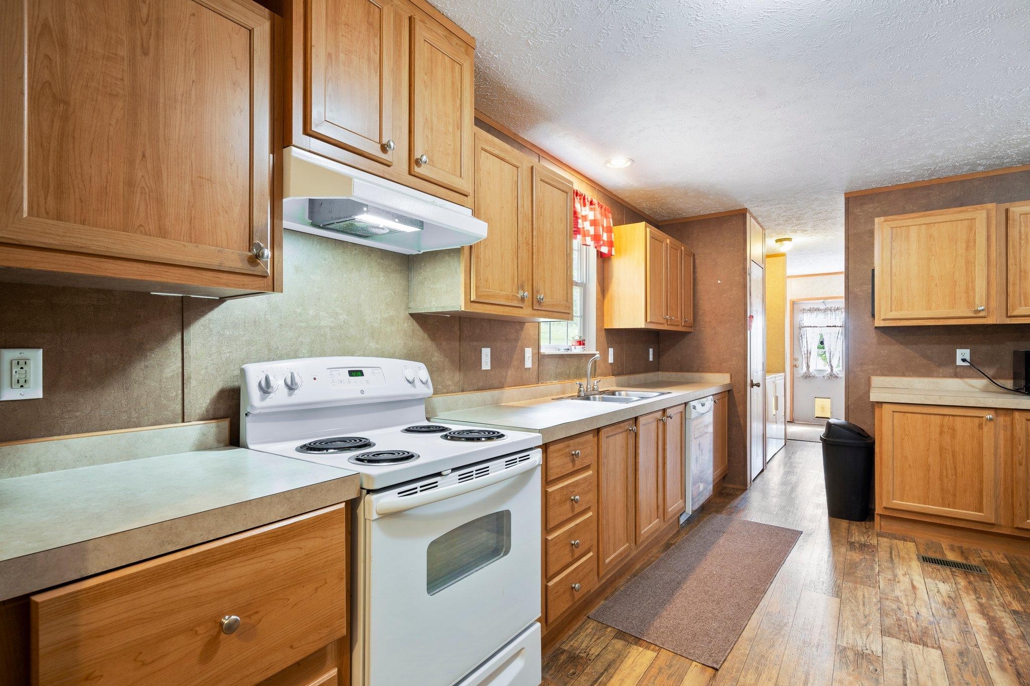 171 Buckner Road Philadelphia, TN 37846 - Photo 16 of 27 a kitchen with stainless steel appliances granite countertop a stove a sink and a microwave