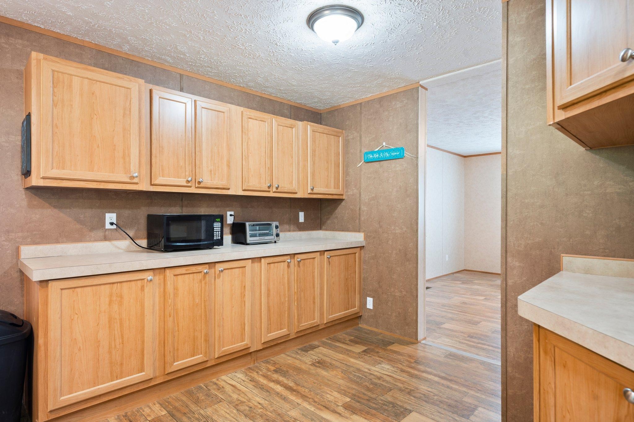 171 Buckner Road Philadelphia, TN 37846 - Photo 17 of 27 a kitchen with stainless steel appliances granite countertop a sink and cabinets