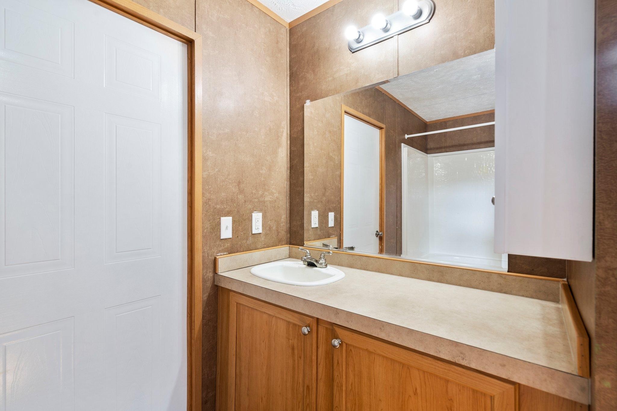 171 Buckner Road Philadelphia, TN 37846 - Photo 21 of 27 a bathroom with a sink and a mirror