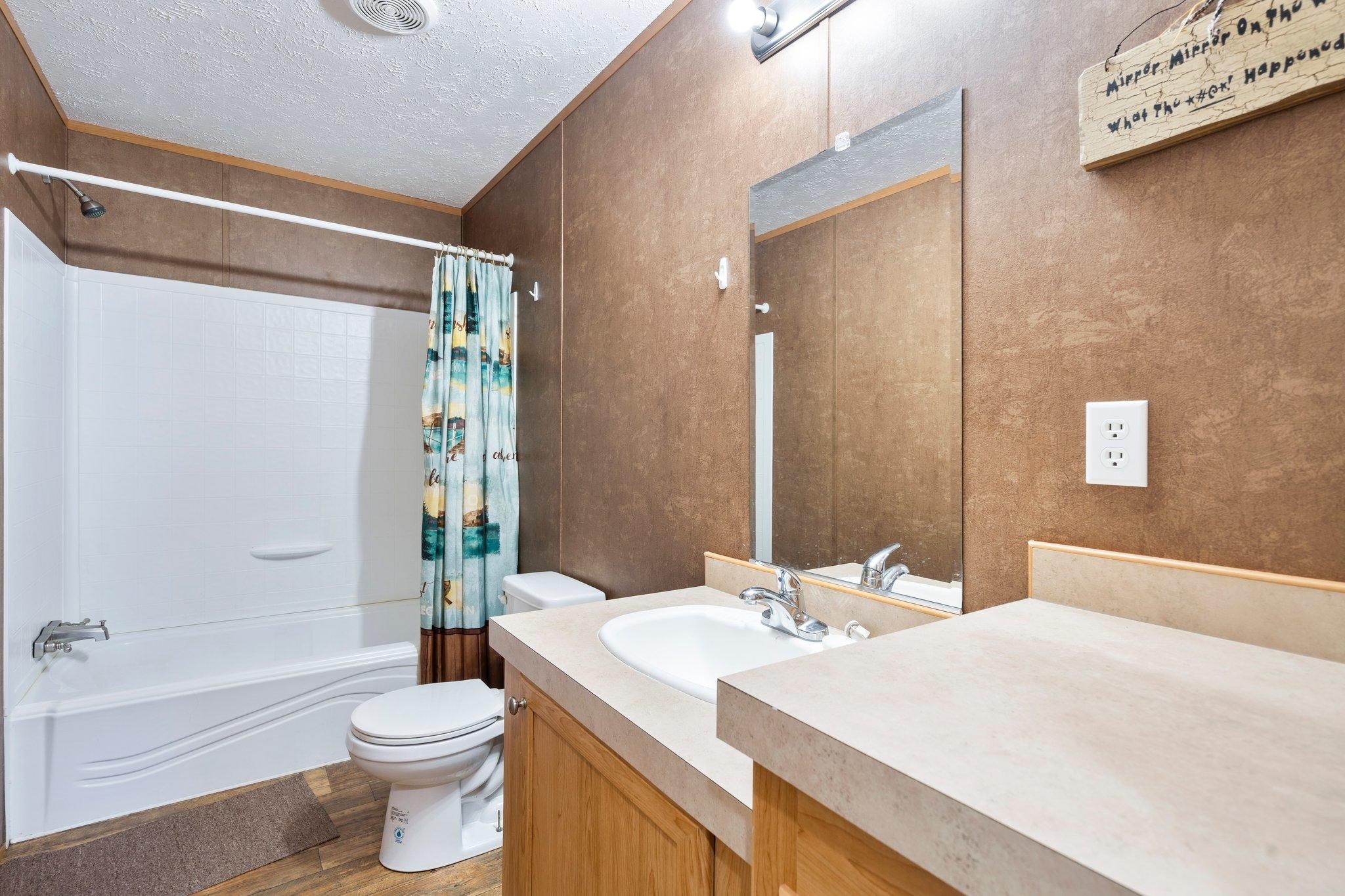 171 Buckner Road Philadelphia, TN 37846 - Photo 24 of 27 a bathroom with a sink a toilet and shower