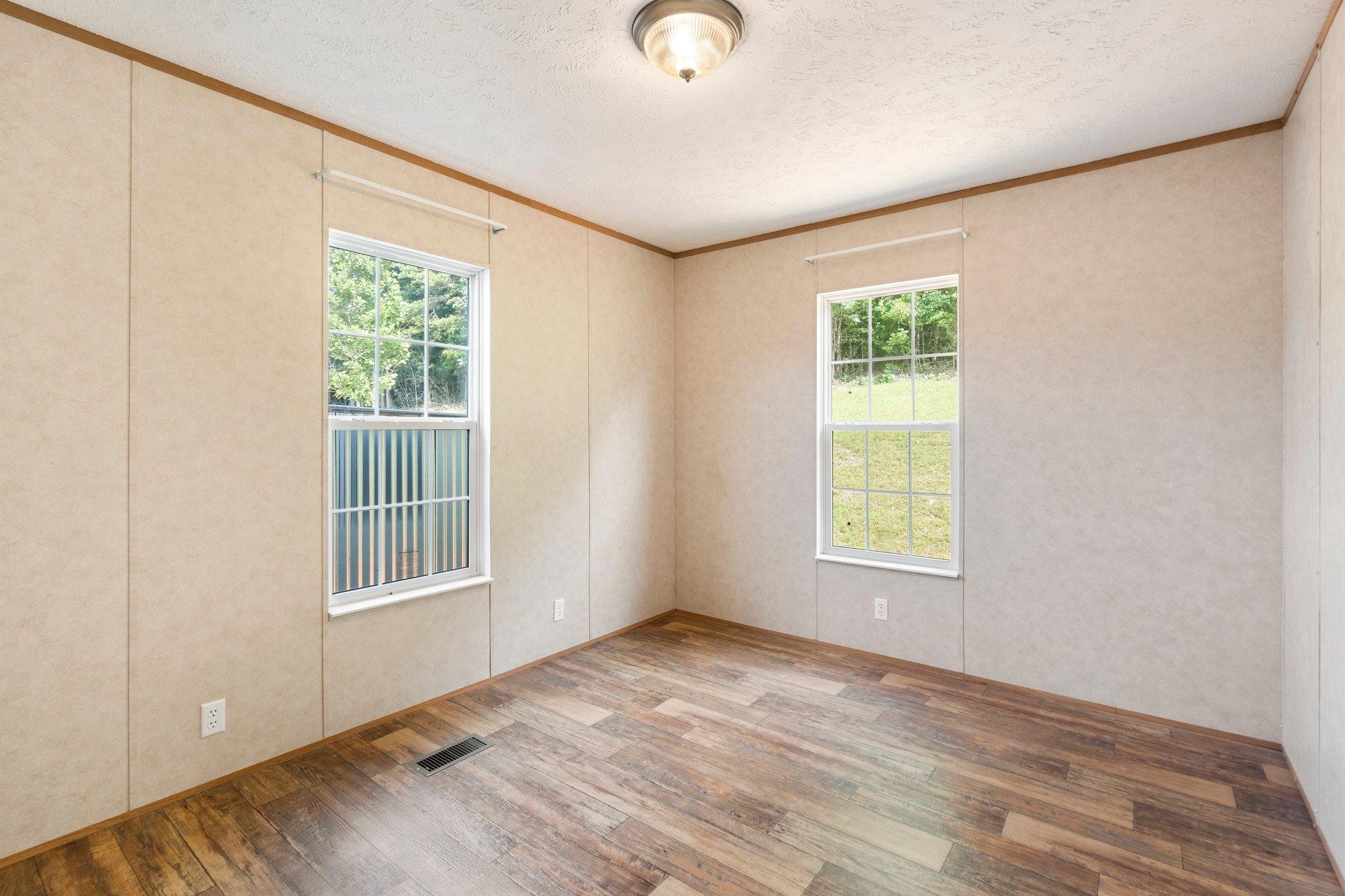 171 Buckner Road Philadelphia, TN 37846 - Photo 25 of 27 an empty room with windows and closet
