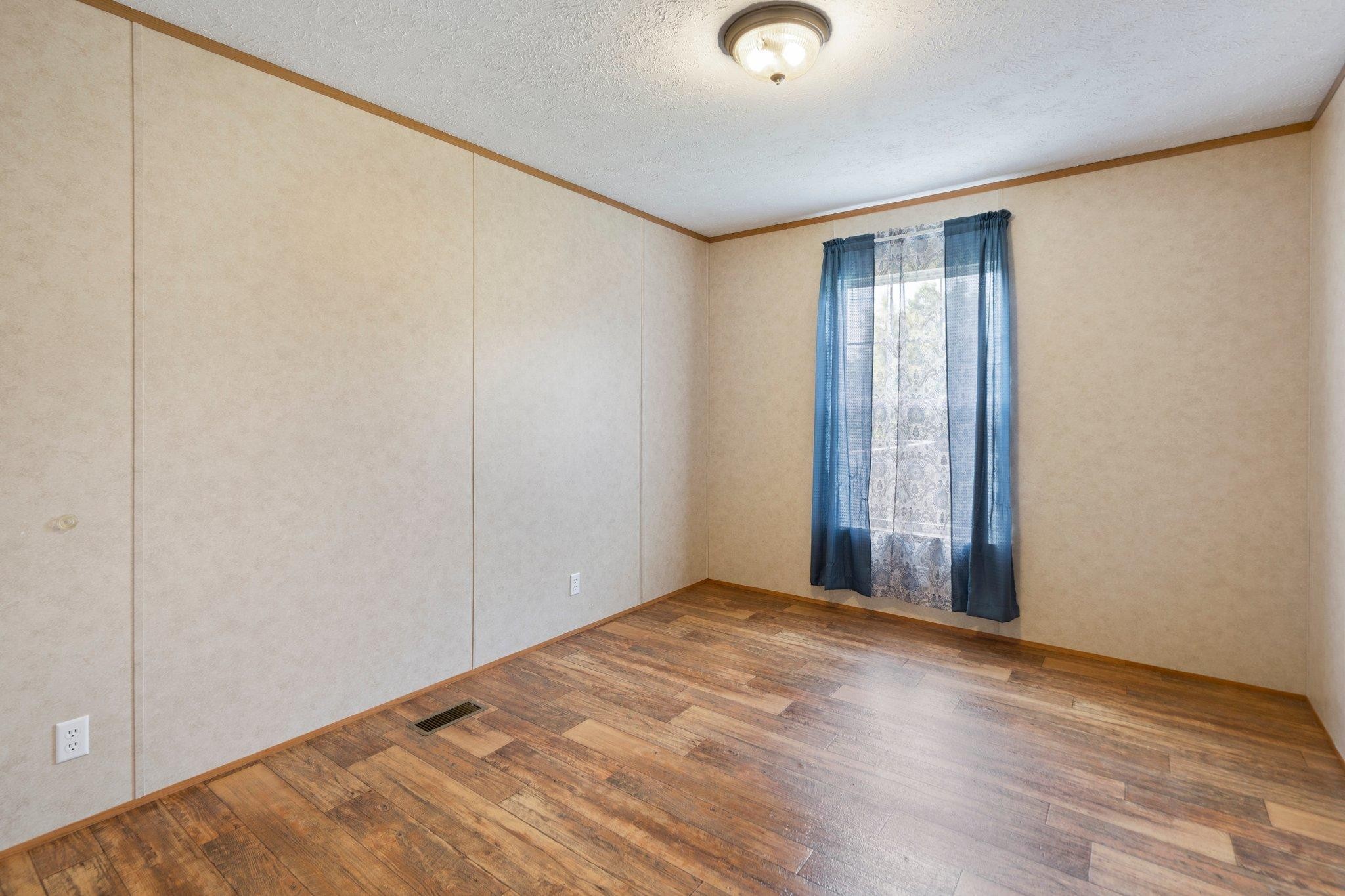 171 Buckner Road Philadelphia, TN 37846 - Photo 27 of 27 a view of an empty room with wooden floor