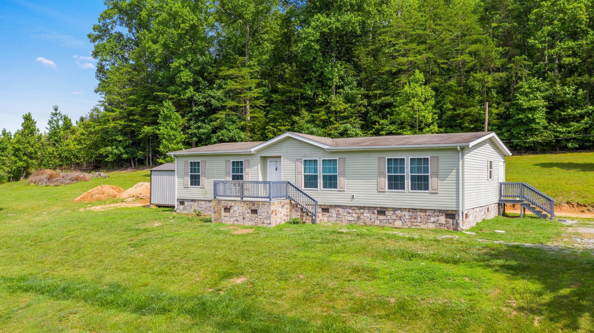 171 Buckner Road Philadelphia, TN 37846 - Photo 3 of 27 a view of a house with a yard and sitting area