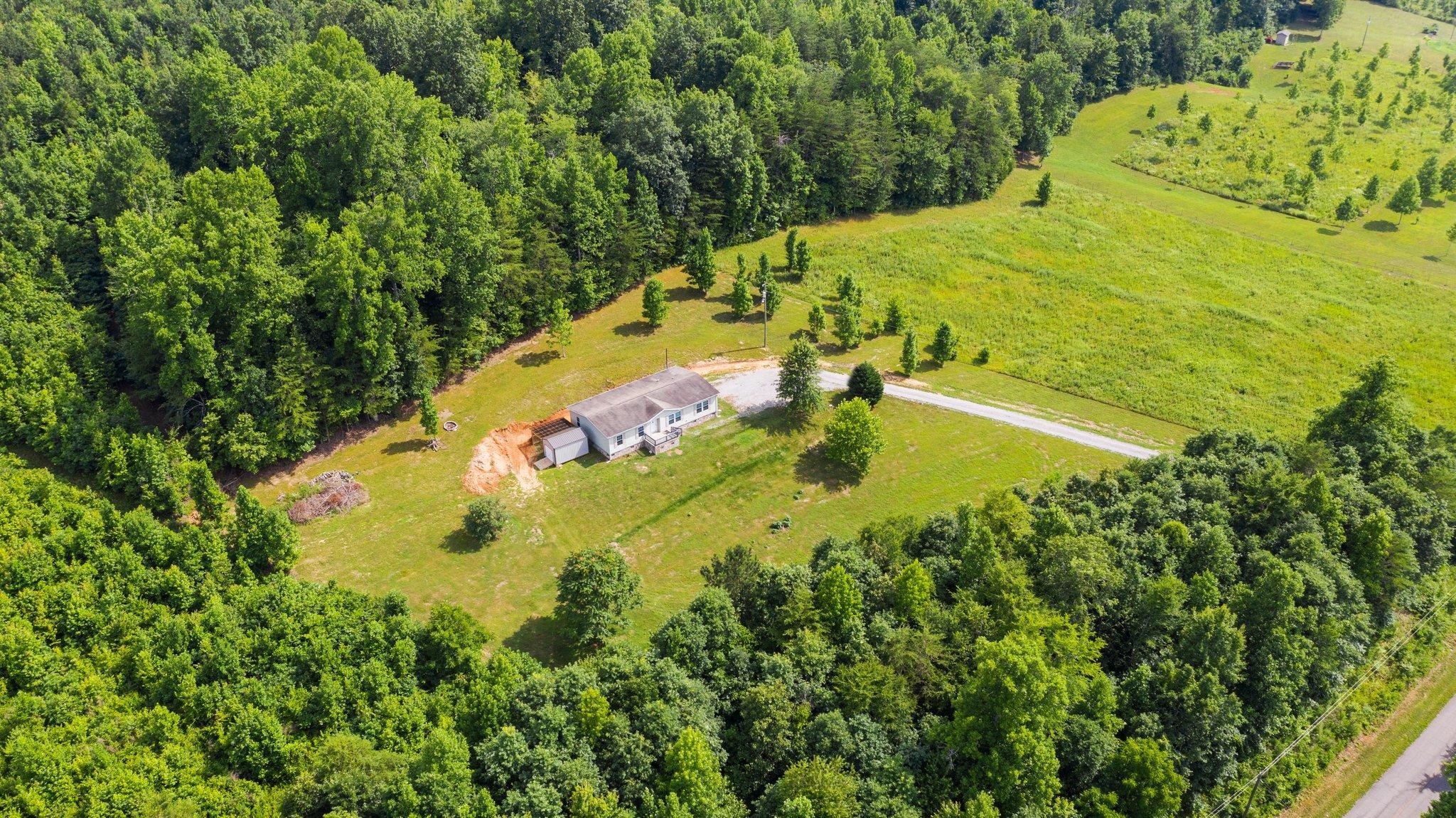 171 Buckner Road Philadelphia, TN 37846 - Photo 8 of 27 a view of a swimming pool with a yard