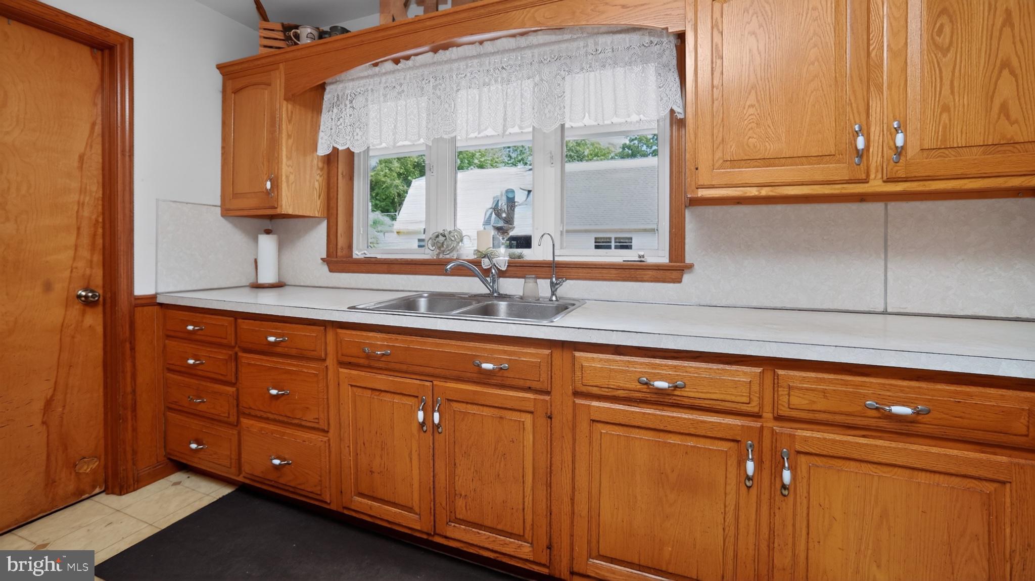257 Hill Road New Holland, PA 17557 - Photo 55 of 94 Warm oak cabinetry in a cozy kitchen.