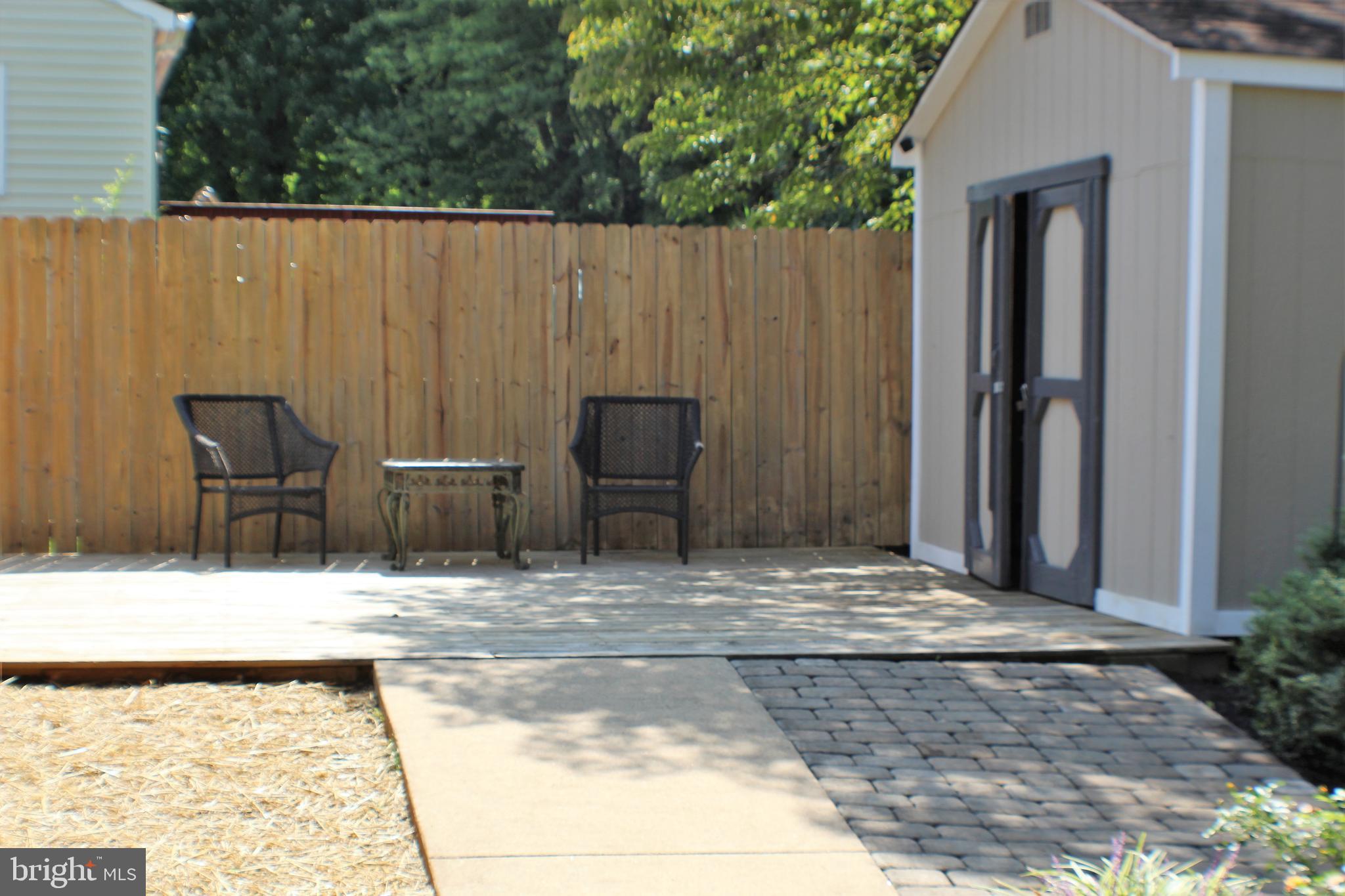 14308 Ferndale Road Woodbridge, VA 22193 - Photo 49 of 65 Decking and paved area in rear yard