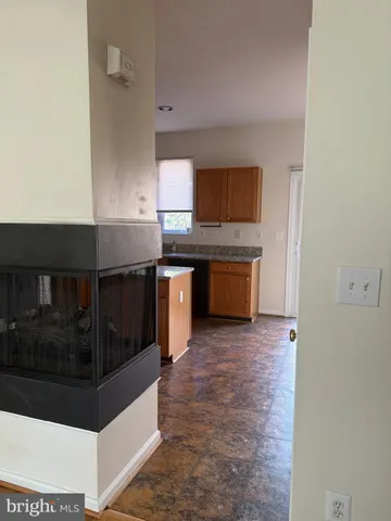 a kitchen with stainless steel appliances granite countertop a sink and a stove