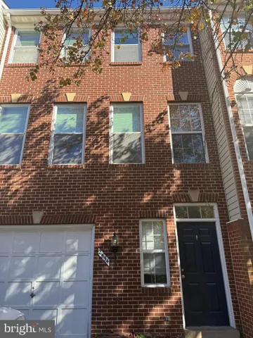 an aerial view of a residential apartment building with a yard