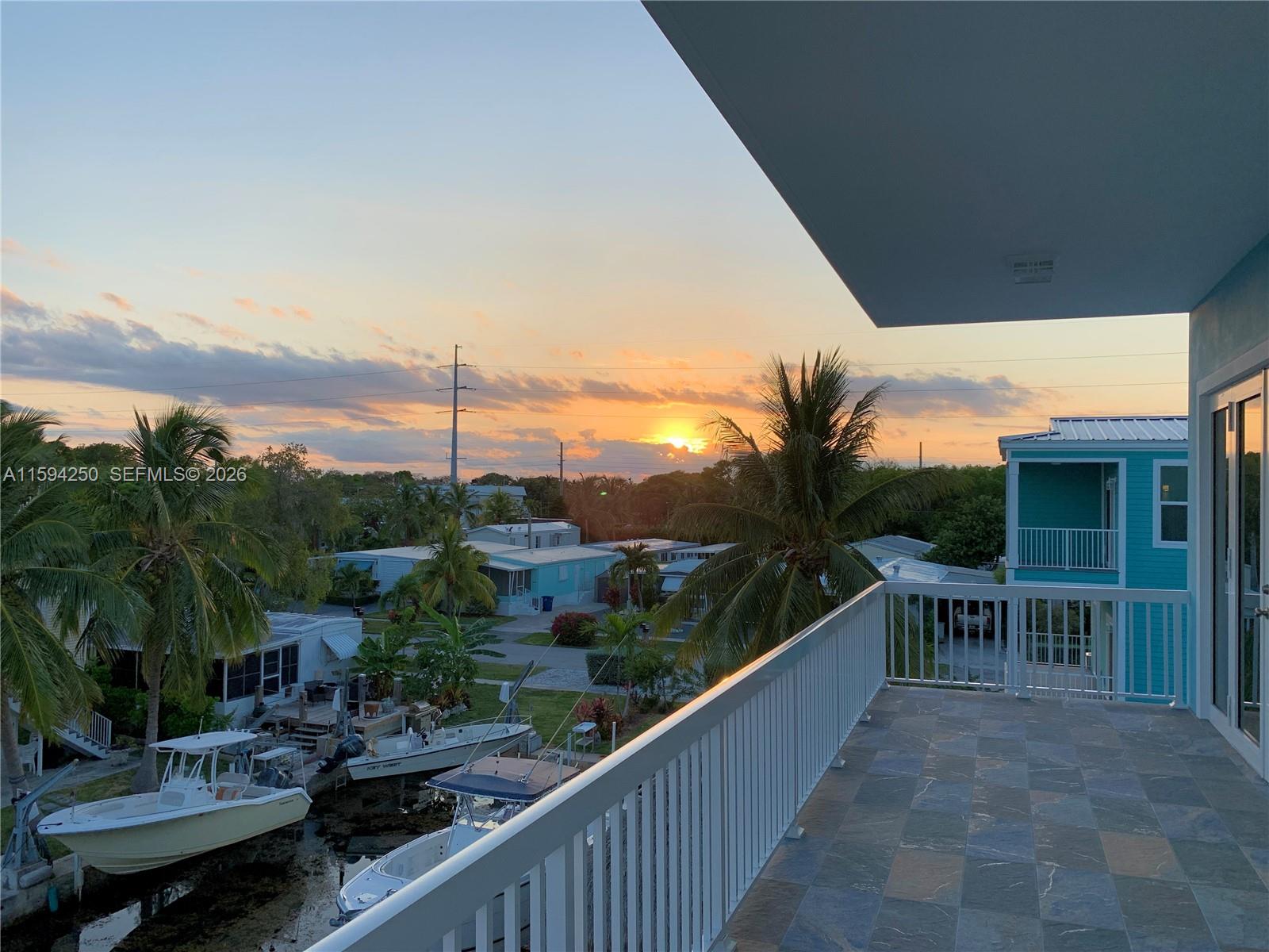 84 Coral Way Key Largo, FL 33037 - Photo 22 of 55 a view of a chairs and table in patio