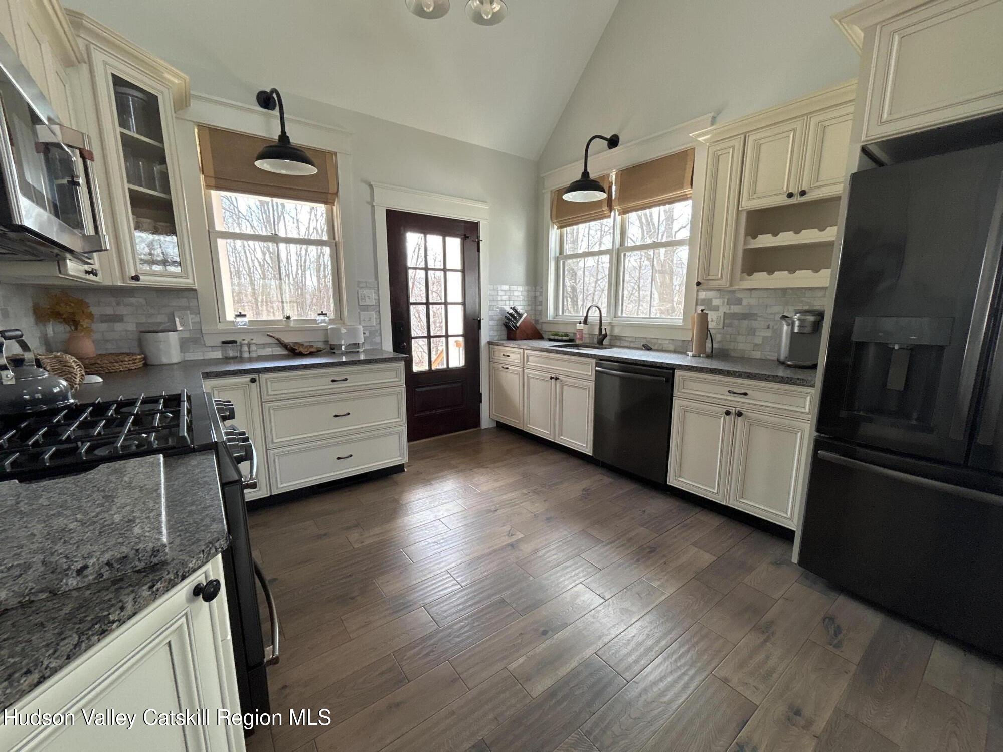 106 Beilke Road Millerton, NY 12546 - Photo 4 of 10 a large kitchen with stainless steel appliances granite countertop a stove refrigerator and a stove top oven