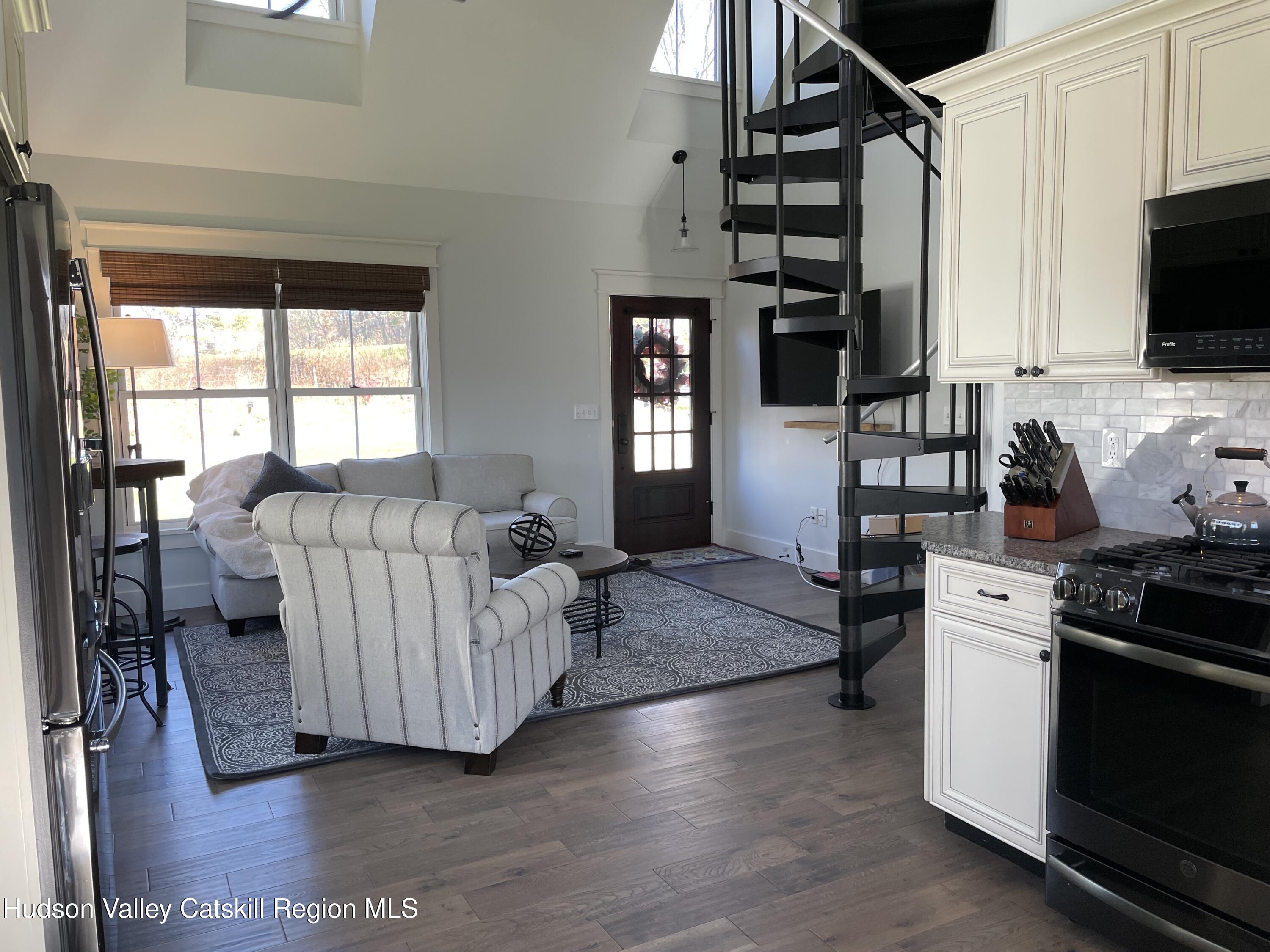 106 Beilke Road Millerton, NY 12546 - Photo 7 of 10 a living room with furniture and flat screen tv