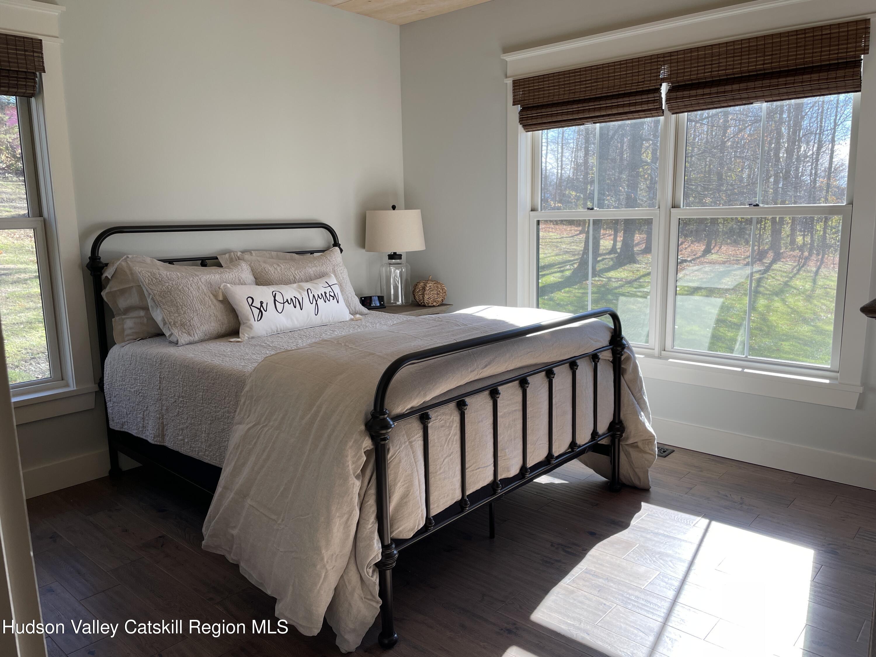 106 Beilke Road Millerton, NY 12546 - Photo 9 of 10 a bedroom with a bed and a window