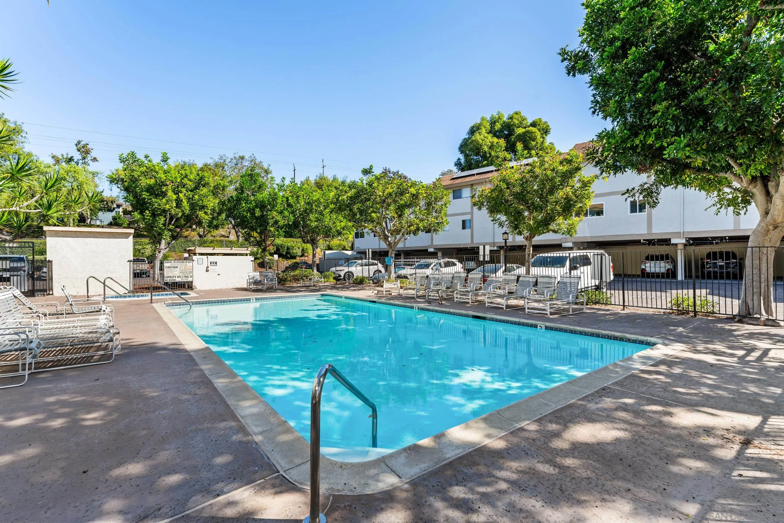 a view of a swimming pool with a patio