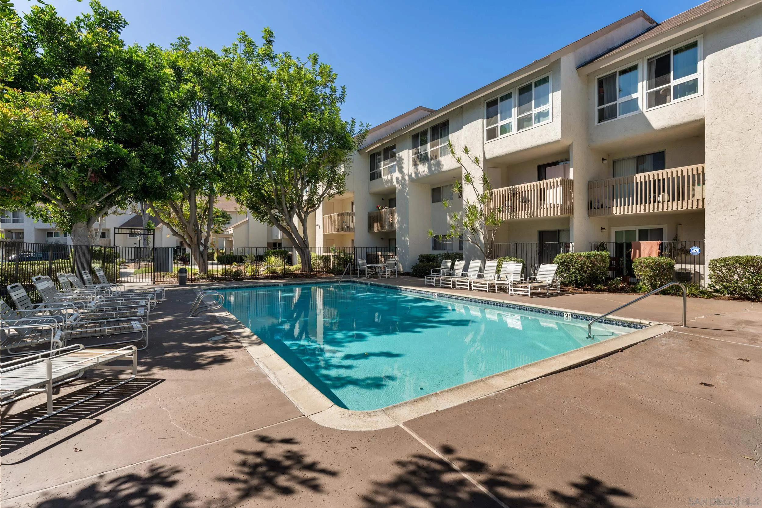 6255 Rancho Mission Road, Unit 217 San Diego, CA 92108 - Photo 18 of 23 a view of a house with a swimming pool