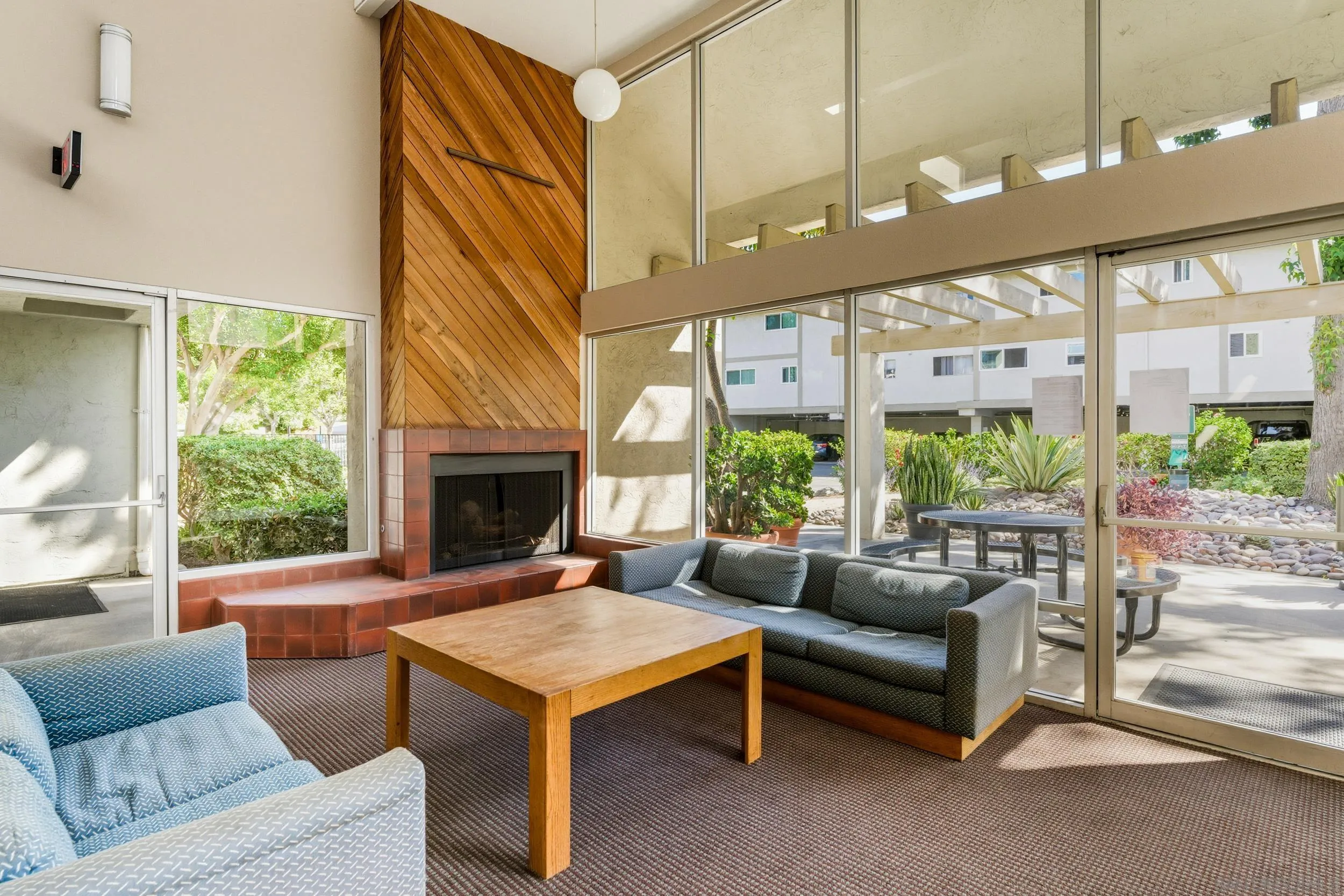 6255 Rancho Mission Road, Unit 217 San Diego, CA 92108 - Photo 20 of 23 a living room with furniture and a large window