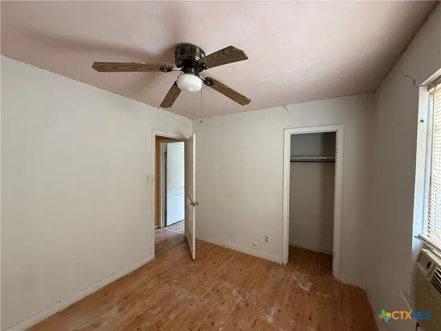 a view of an empty room and window