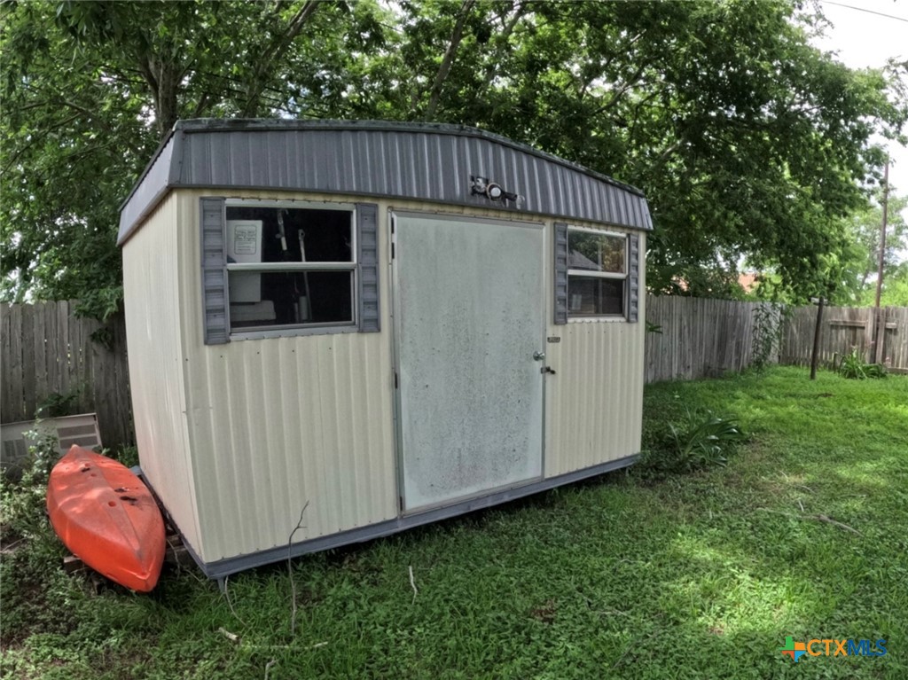 119 Runnels Street Port Lavaca, TX 77979 - Photo 4 of 18 a view of a small house with yard