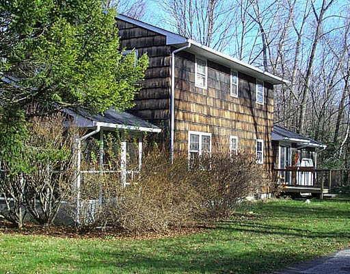 7 Mill View Terrace Ridgefield, CT 06877 - Photo 1 of 1 a front view of a house with a yard