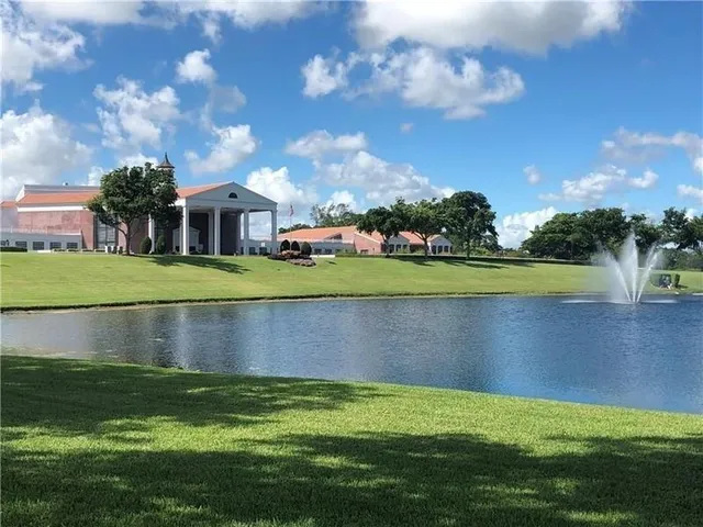 a view of swimming pool with outdoor seating and lake