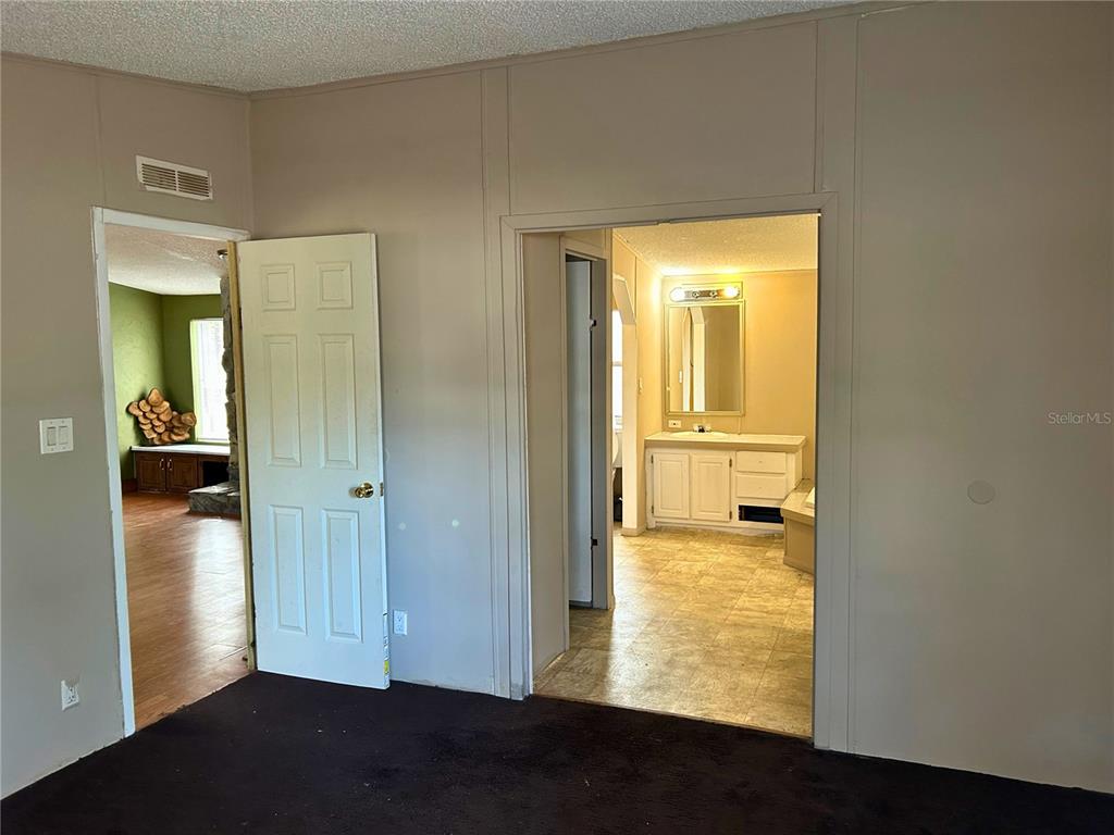 9867 Jerome Drive New Port Richey, FL 34654 - Photo 9 of 30 a view of a bathroom with a door