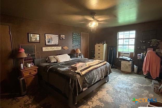 419 West Main Street Lometa, TX 76853 - Photo 6 of 16 a bedroom with a bed and a tv on the dresser