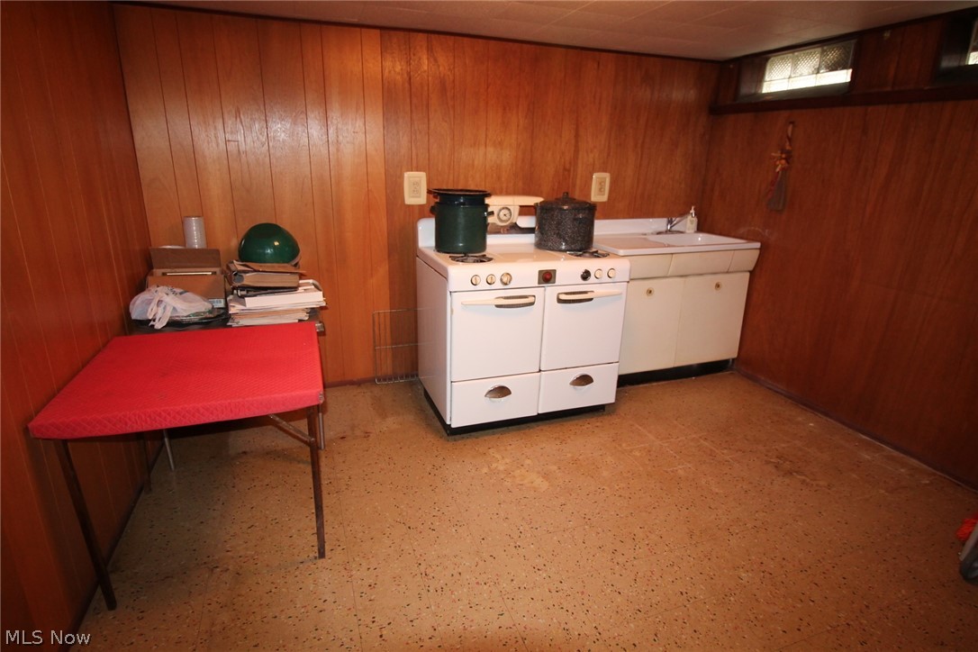 7930 Royal Ridge Drive Parma, OH 44129 - Photo 22 of 24 EXTRA ROOM IN THE BASEMENT IS CURRENTLY USED AS A SUMMER KITCHEN