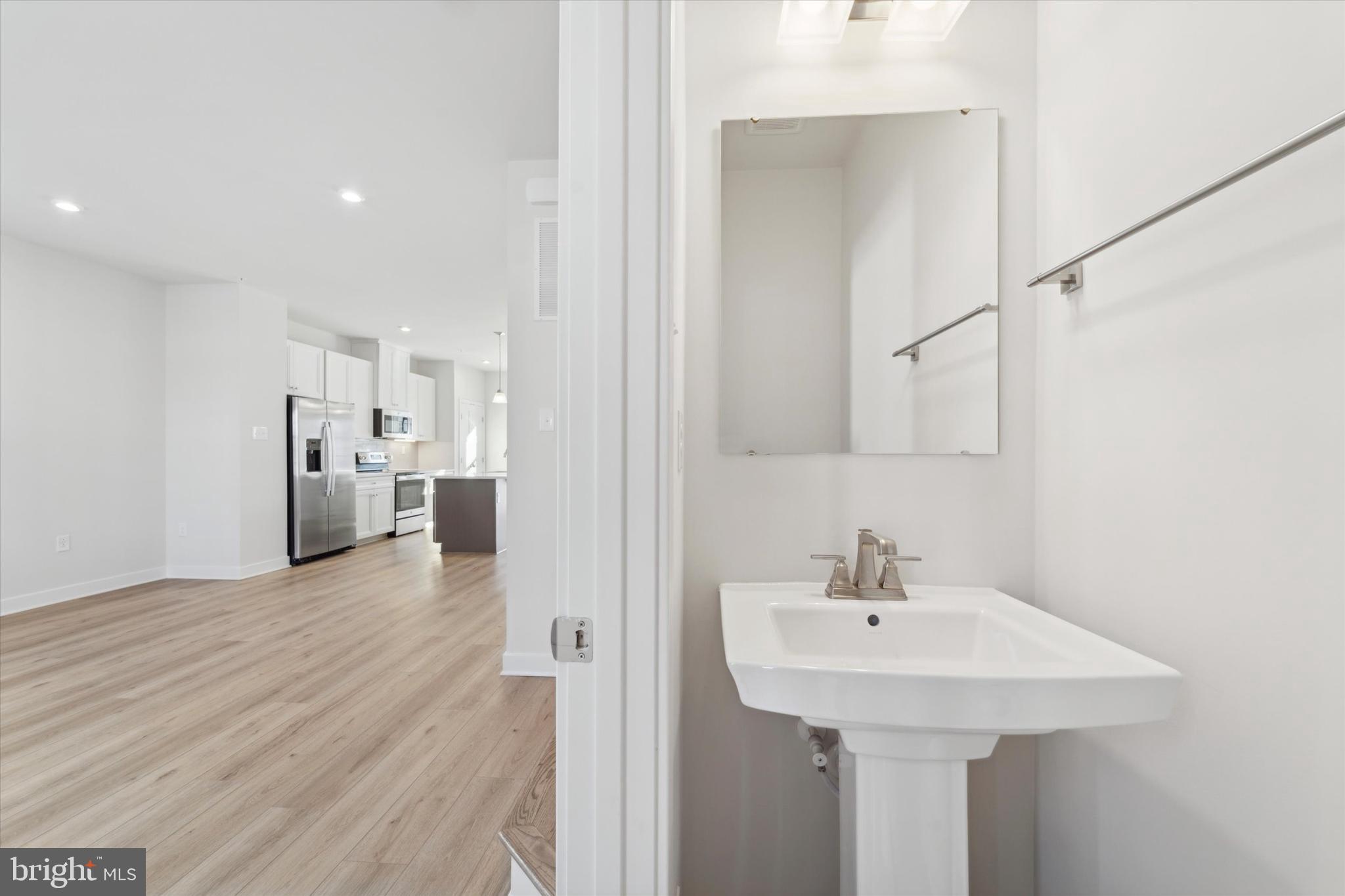 208 River Birch Way Exton, PA 19341 - Photo 13 of 25 a bathroom with a sink and a mirror