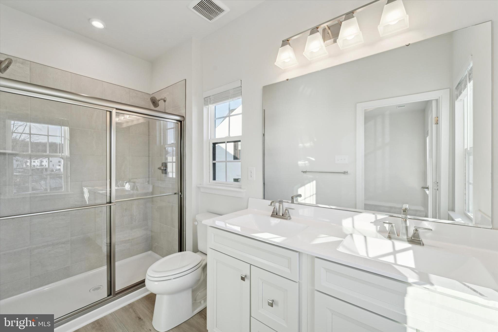 208 River Birch Way Exton, PA 19341 - Photo 16 of 25 a bathroom with a granite countertop sink toilet and shower