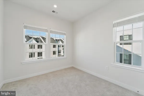 an empty room with closet area