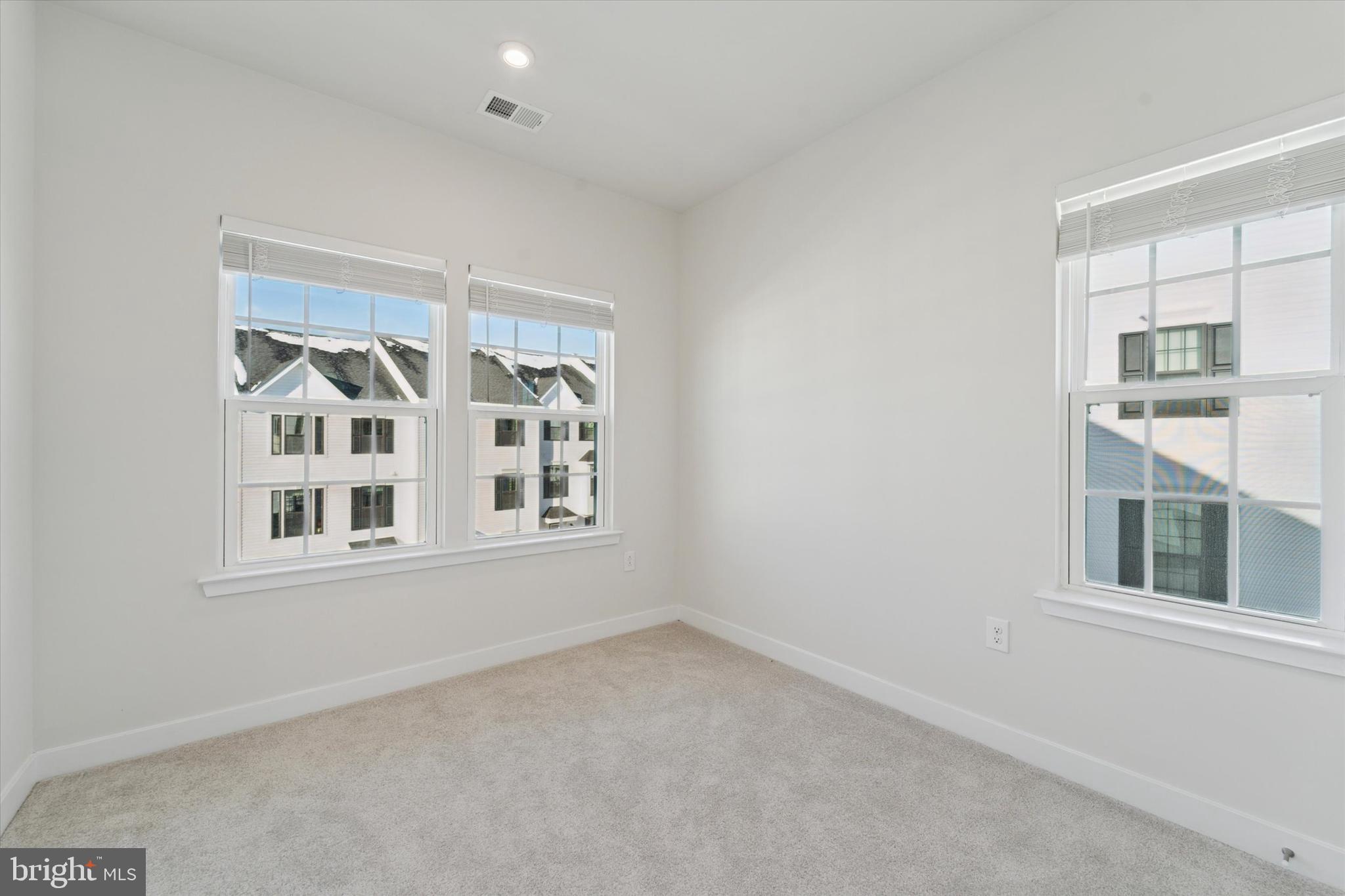 208 River Birch Way Exton, PA 19341 - Photo 17 of 25 a view of an empty room with a window