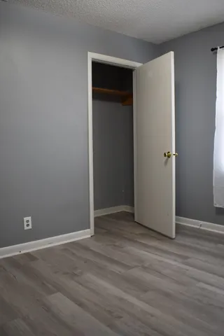 a white toilet sitting next to a bath tub