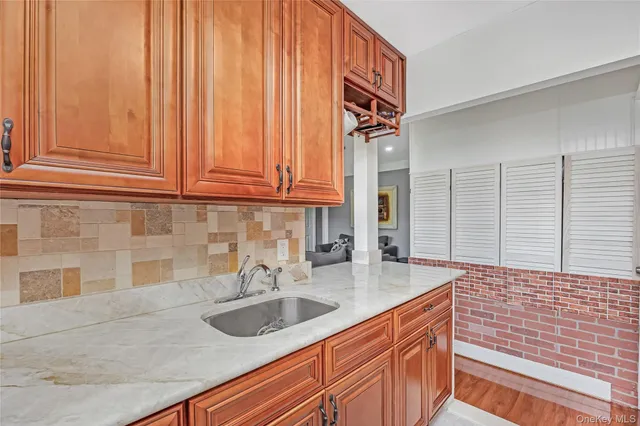 a kitchen with a sink and cabinets