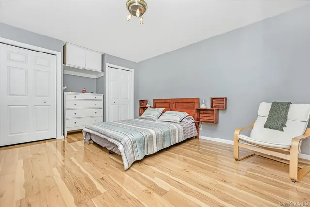 a bedroom with a bed and a chair