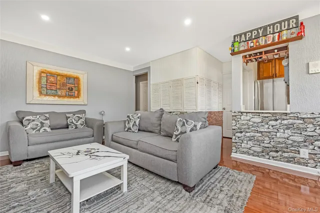 a living room with furniture and a rug