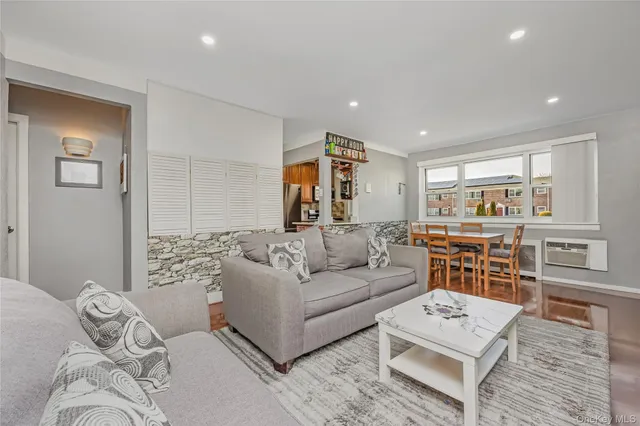 a living room with furniture and a table